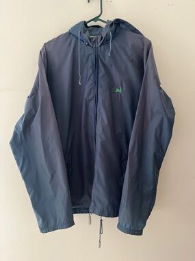 vintage Woolrich Navy Hooded Windbreaker with Green cape cod logo size medium